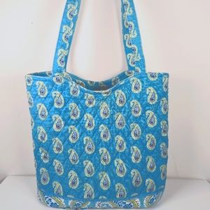 Vera Bradley- Hand Bag clean on the inside and outside. It has various pockets.